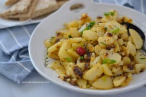 Pan-fried potatoes cooked with garlic onions and pepper