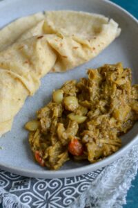 This is a photo of Guyanese katahar curry served with dal puri