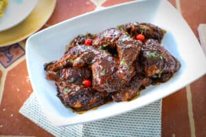 This is a photo of pot roast chicken in a white bowl