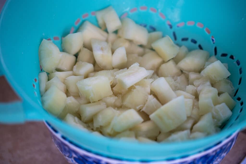 cooked cassava in a blue bowl