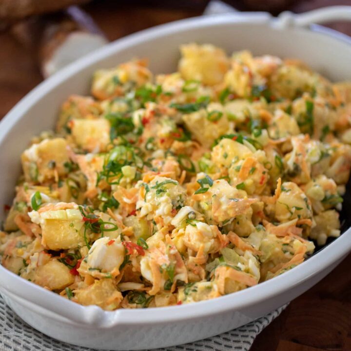 This is a photo of cassava salad in a white serving dish