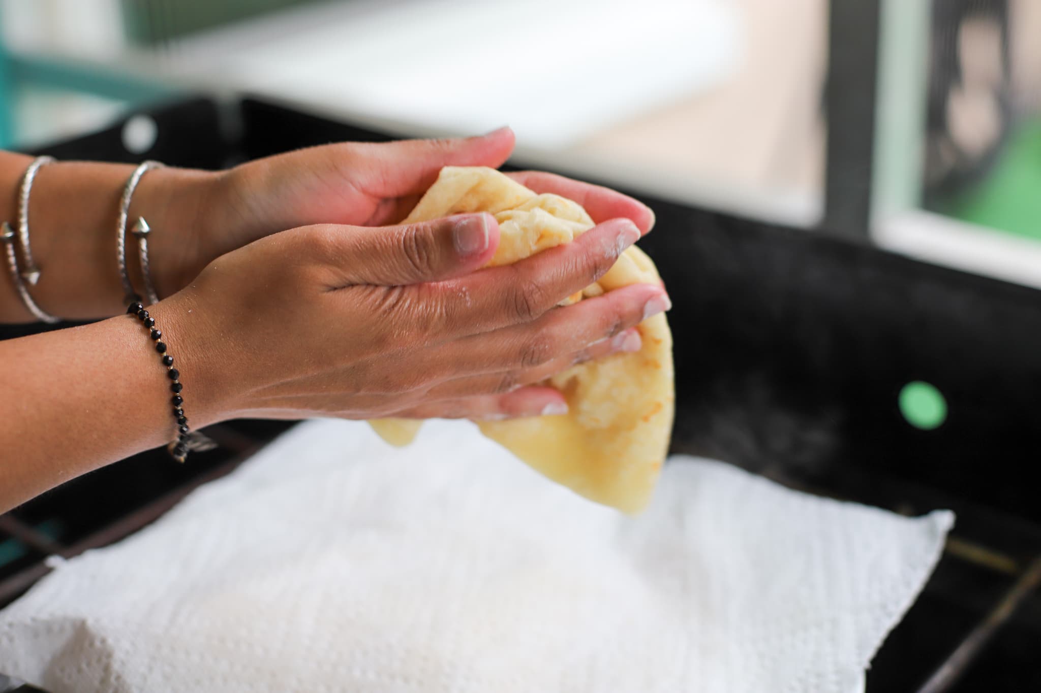 clapping the roti with hands