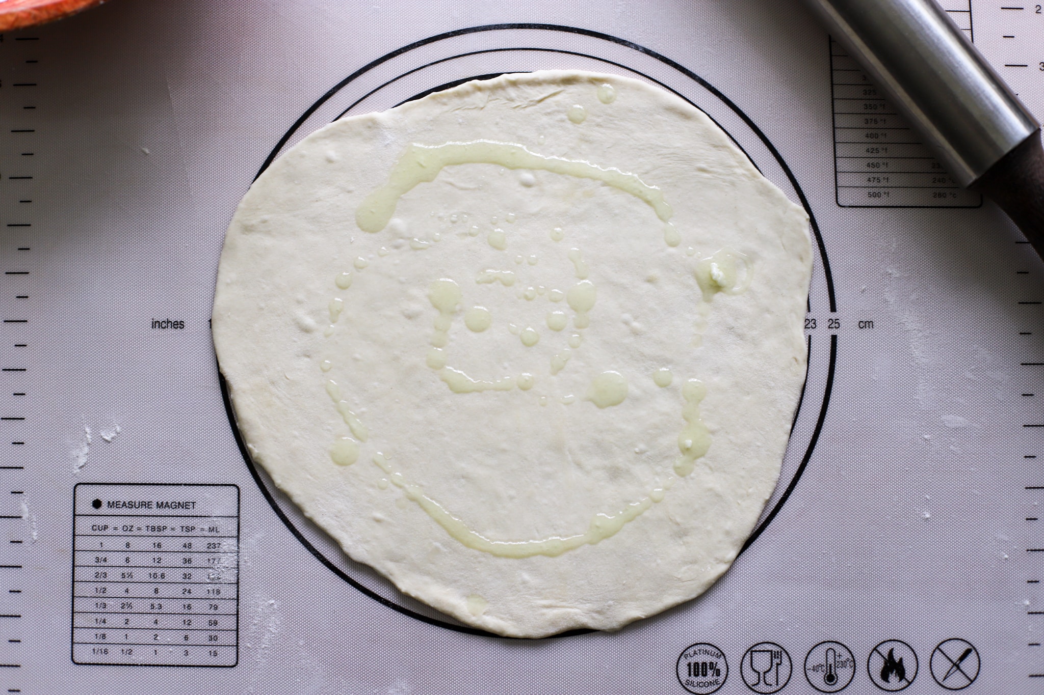 roti dough with oil drizzled on it