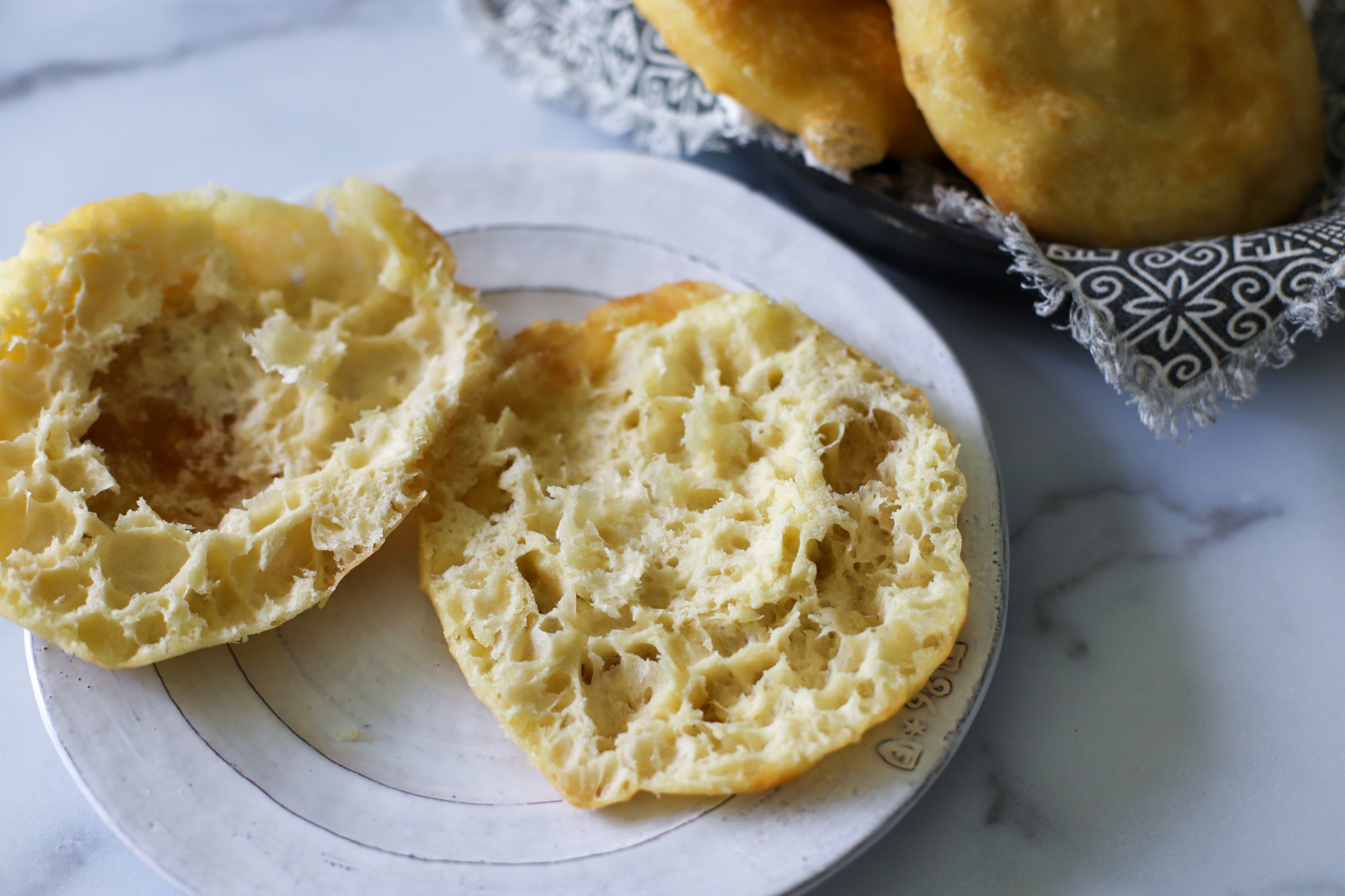 This is an image of west indan fried bake showing the inside. it is fluffly looking and airy.