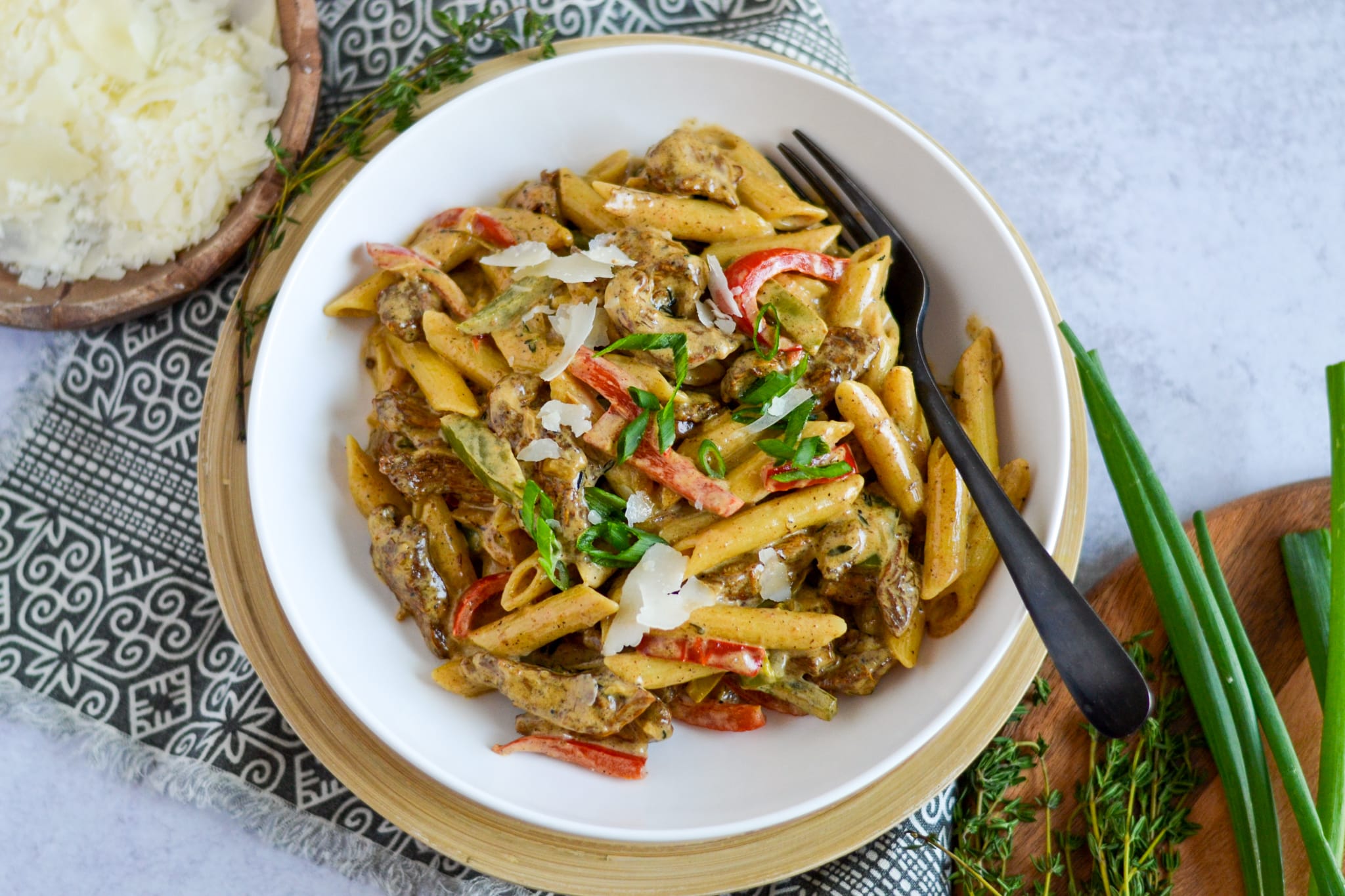 Rasta pasta in a white bowl on table