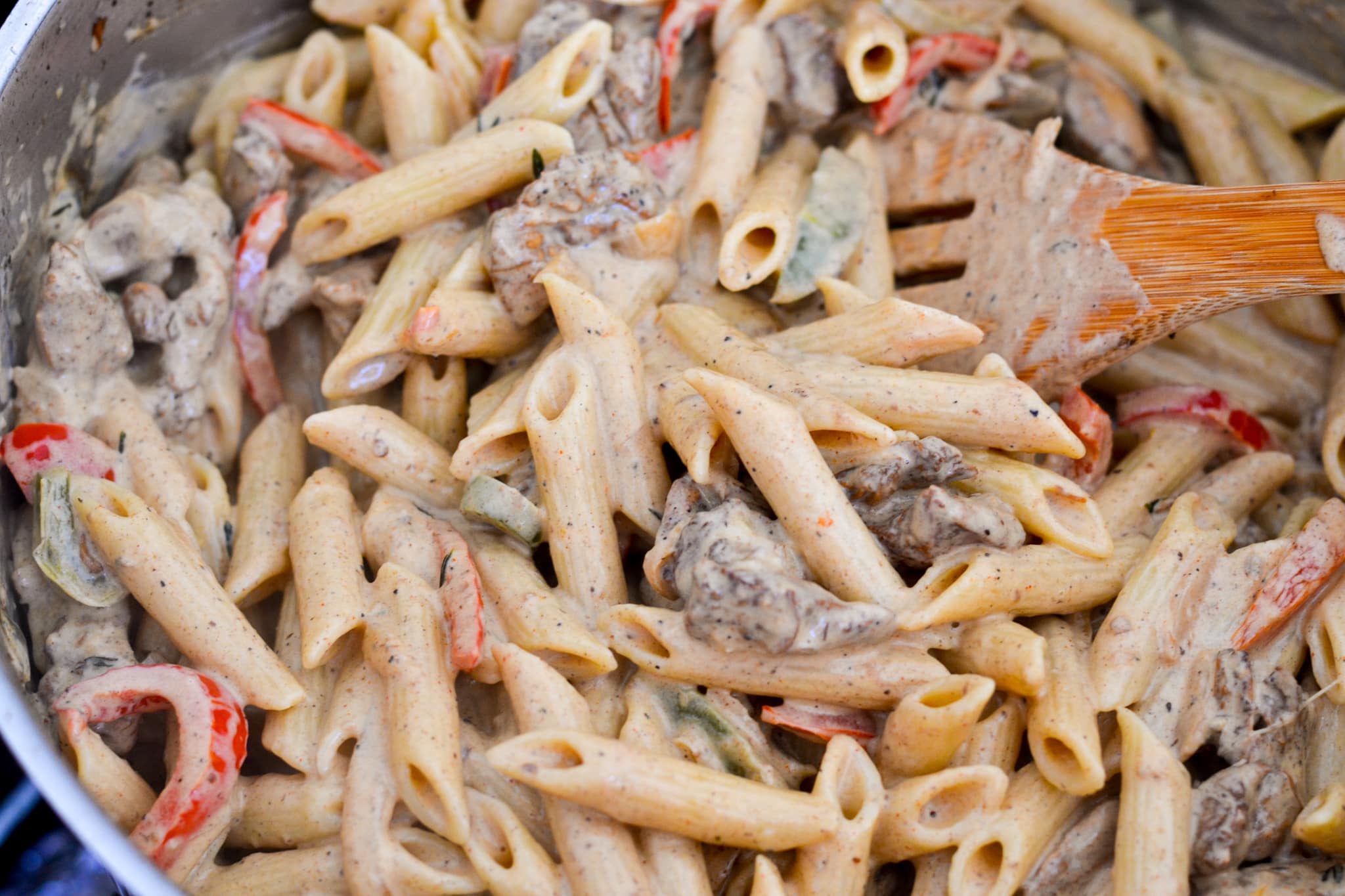 rasta pasta combined in pot penne pasta covered in sauce