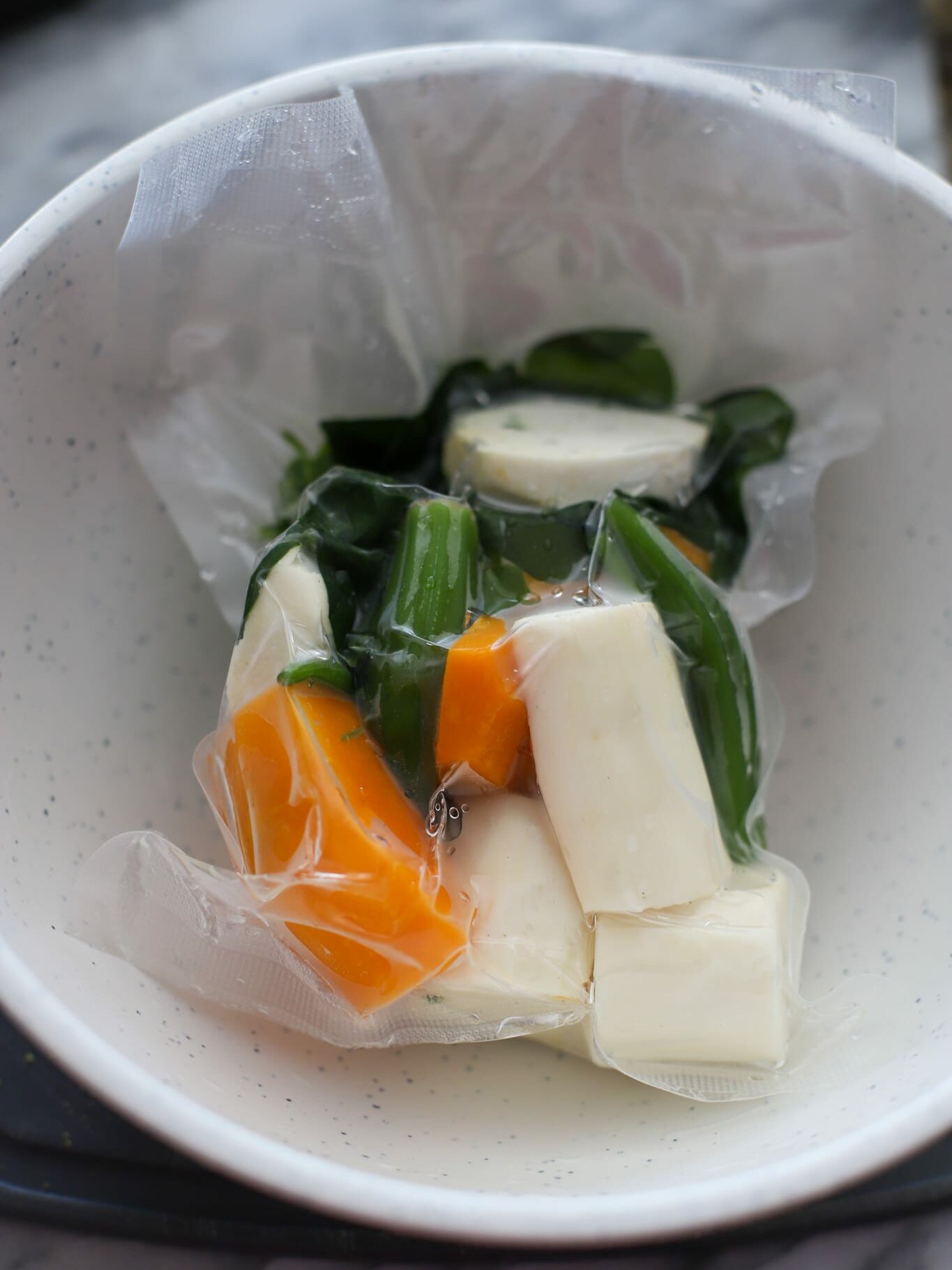 Vacuum sealed left over soup vegetables cassava pumpkin okra and spinach