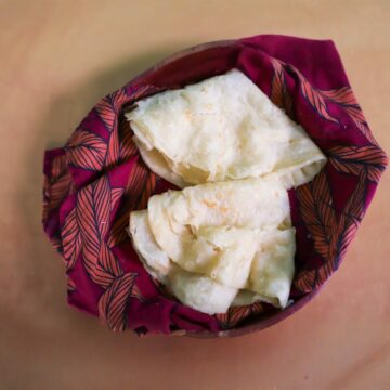 two guyanese oil rotis in a bowl for small batch